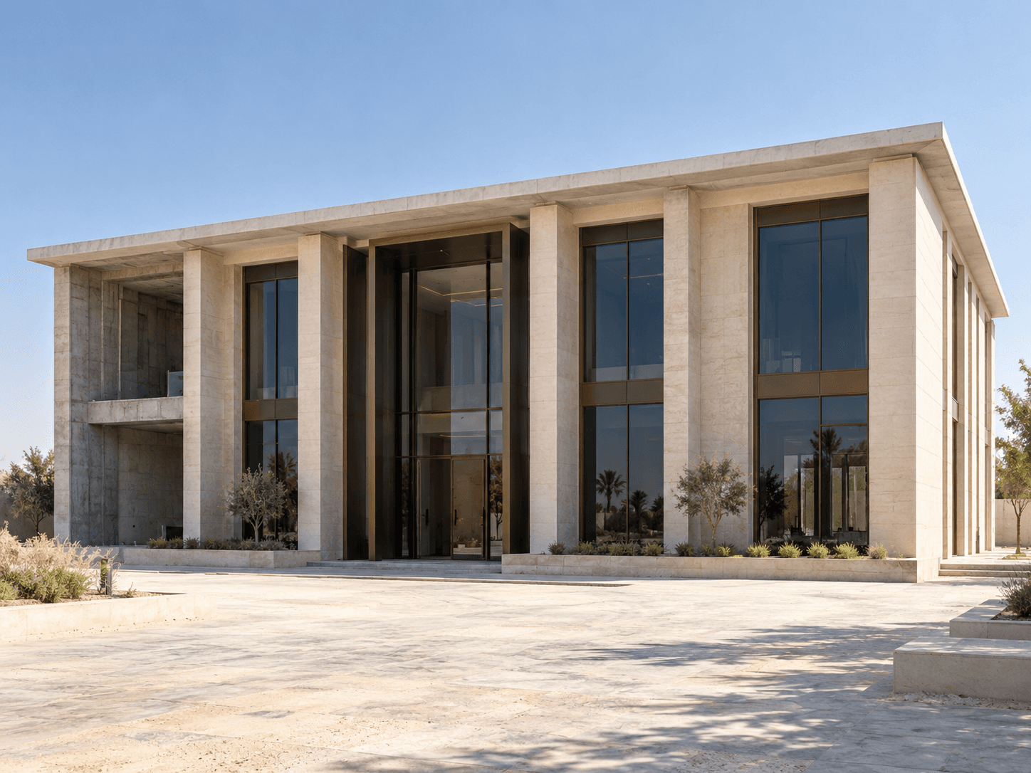تصور توضيحي لمبنى من طابقين بواجهة حجرية وزجاجية ومدخل مركزي غائر.